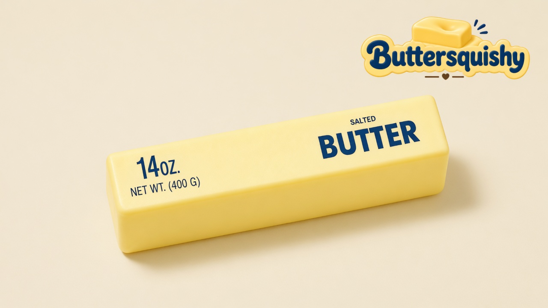 Pale yellow Jumbo Butter Loaf 14oz printed SALTED BUTTER and 14OZ. on a light-yellow cream studio table, Buttersquishy logo at upper right