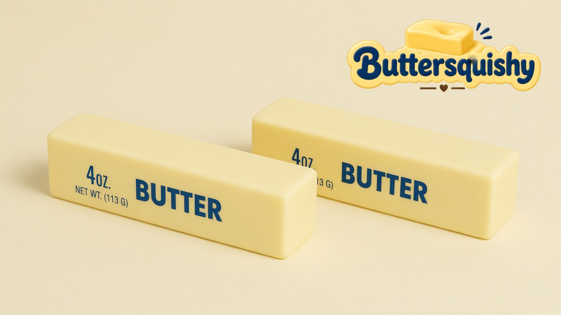 Two pale yellow Bread Toast Loaf sticks printed with navy 4oz and BUTTER on a light-yellow cream studio, Buttersquishy logo in the upper right