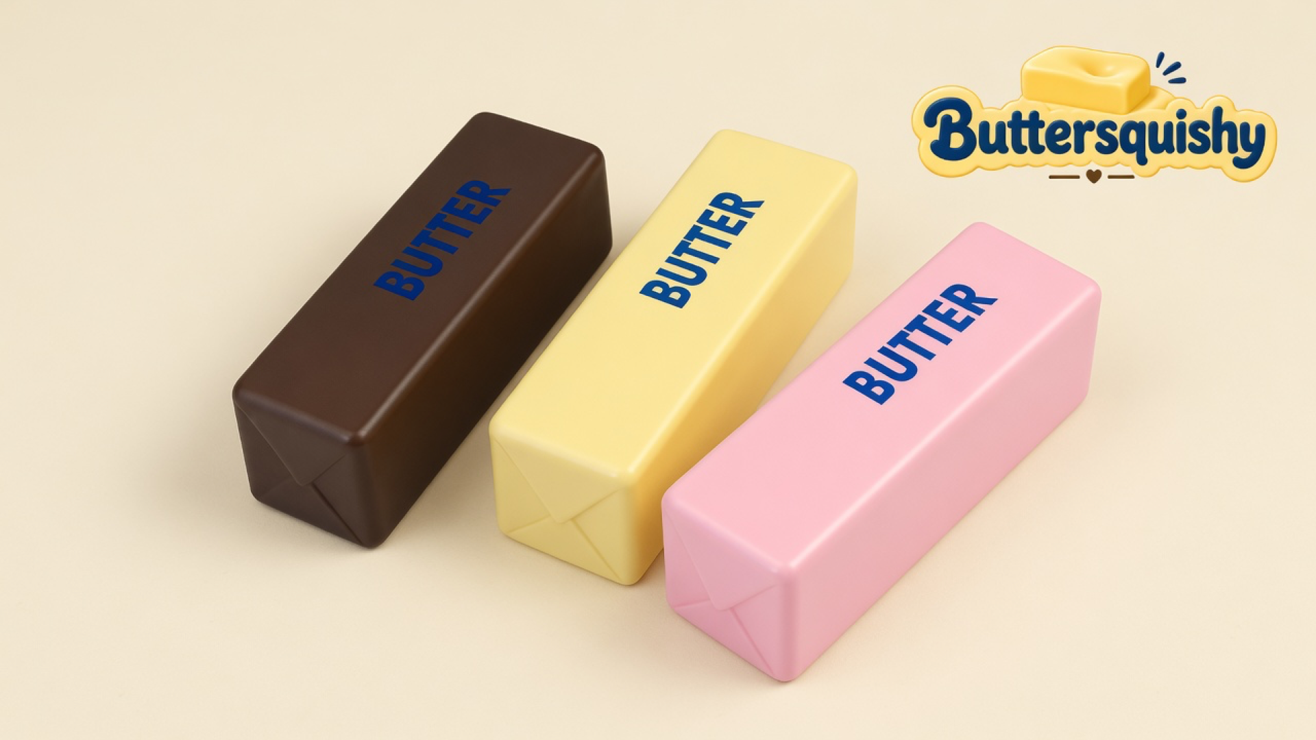 Three Chocolate Berry Butter sticks in chocolate brown, pale yellow, and berry pink with navy BUTTER prints on a light-yellow cream studio, Buttersquishy logo in the upper right