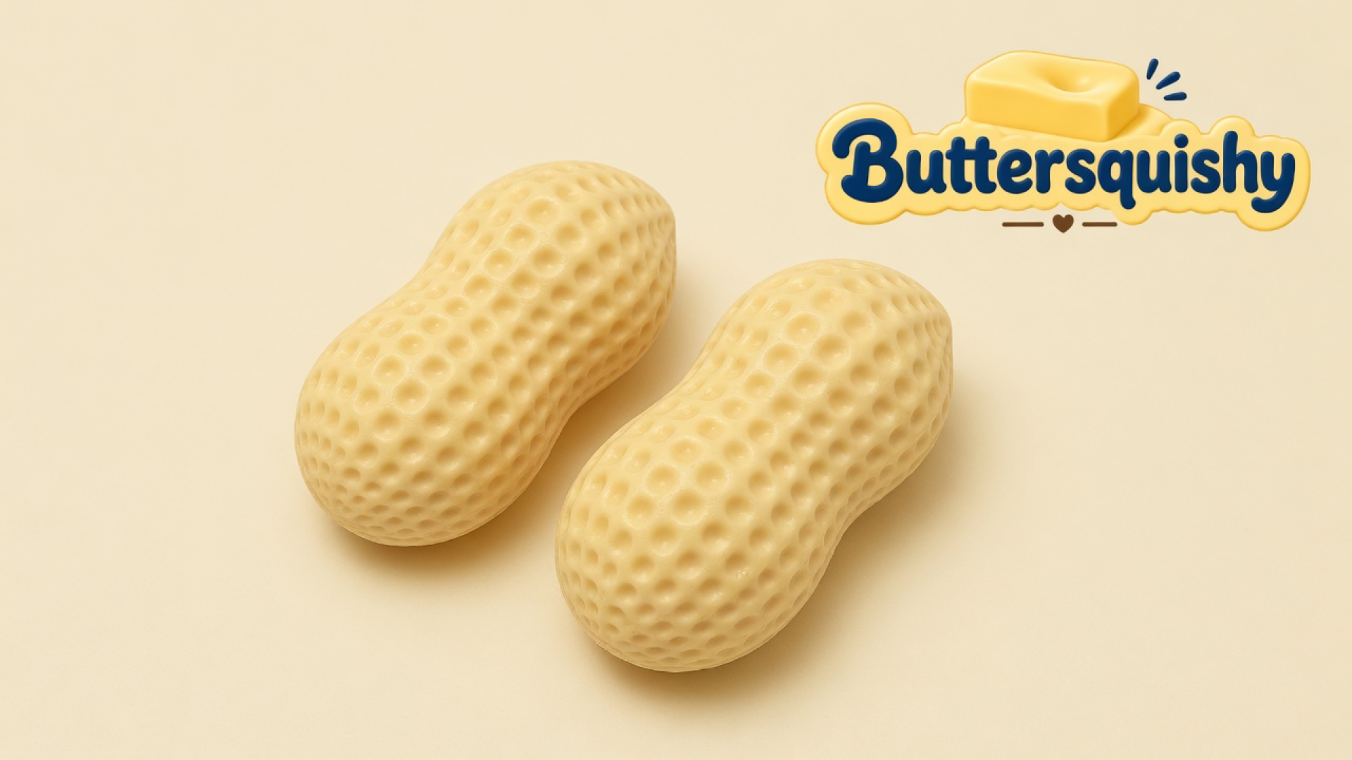 Two pale yellow dimpled peanut-shell Mixed Butter Pack toys on a light-yellow cream studio, Buttersquishy logo in the upper right