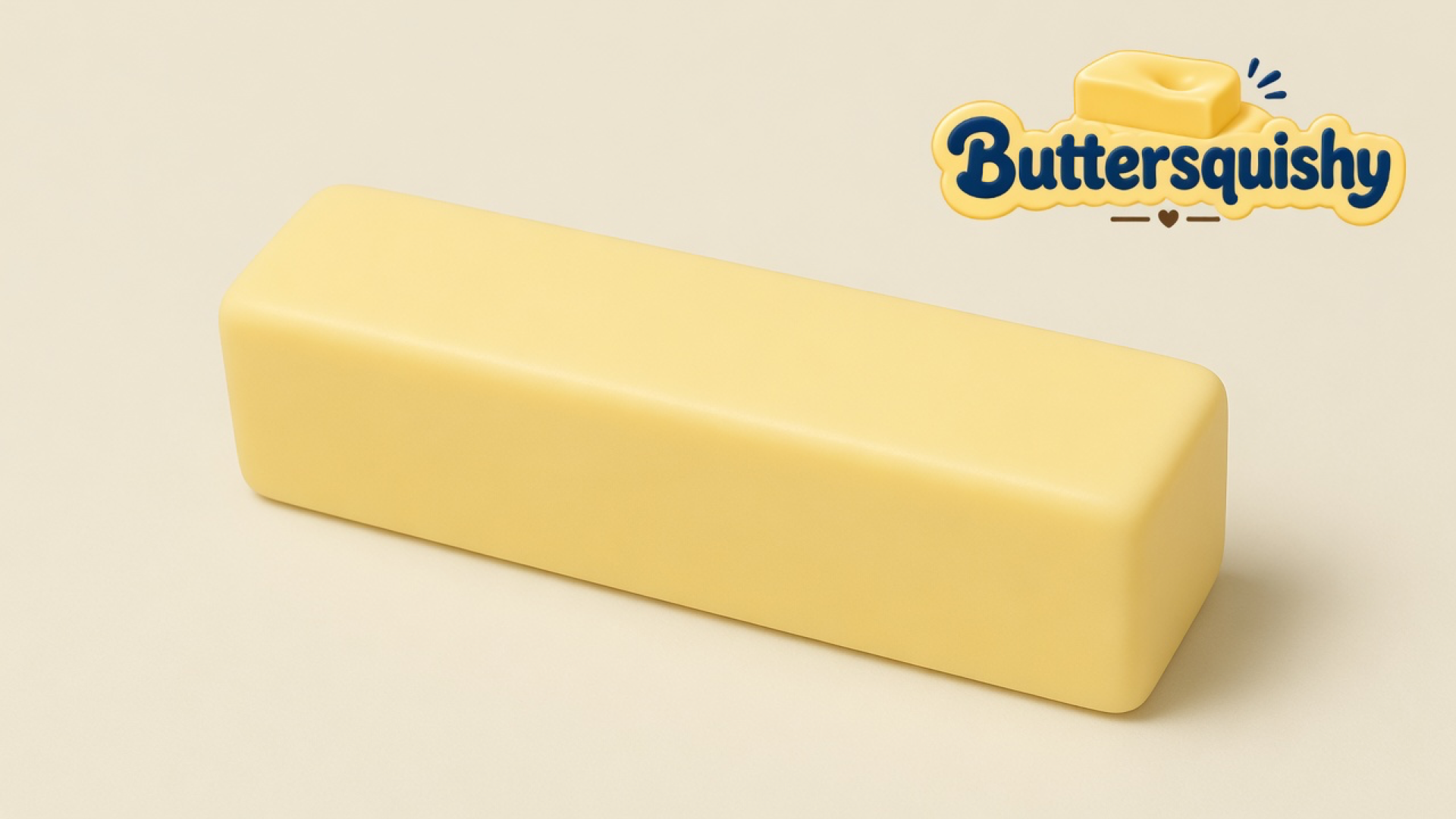 A blank pale-yellow Classic Gift Butter stick on a light-yellow cream studio, Buttersquishy logo in the upper right
