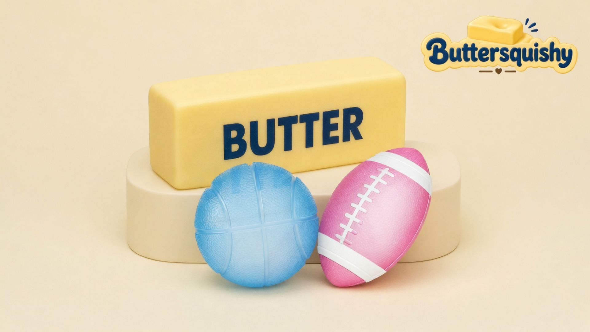 Yellow BUTTER stick, pebbled blue basketball, and pink football with white end stripes on a light-yellow cream studio, Buttersquishy logo in the upper right