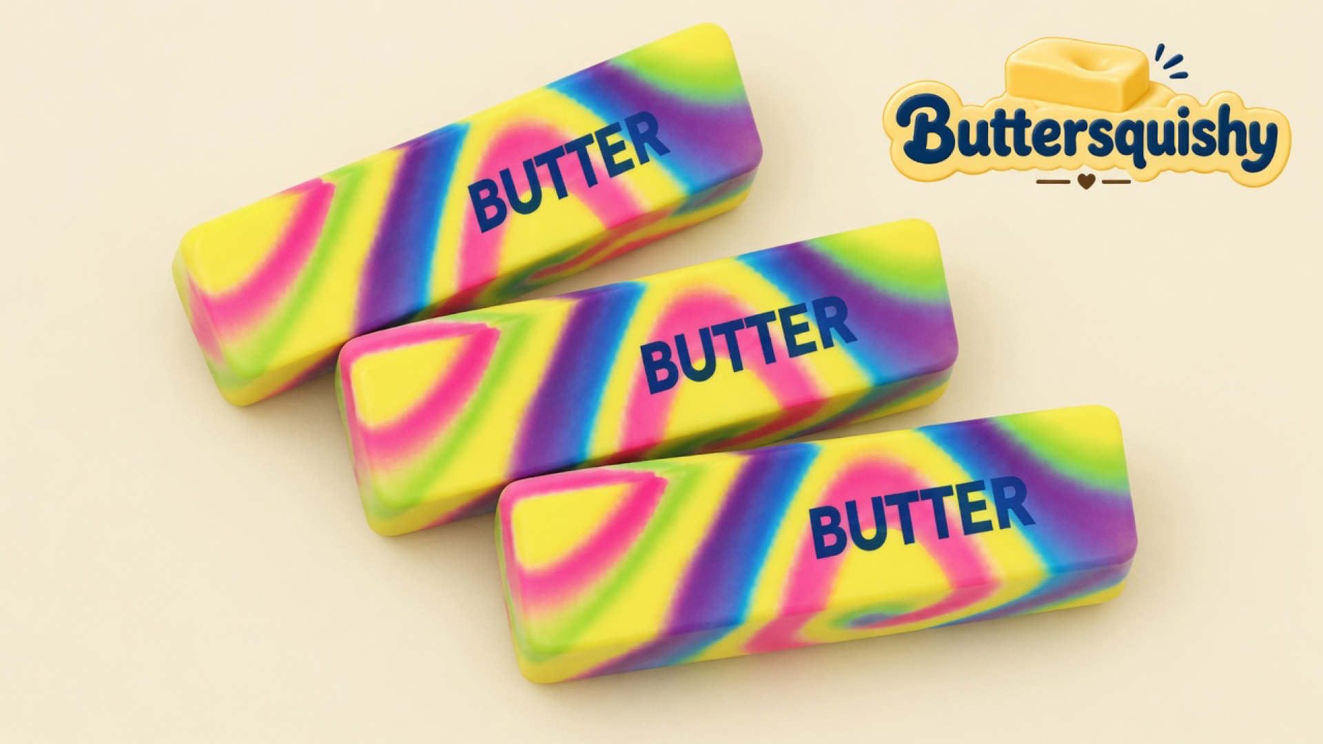 Three neon-swirl butter sticks printed BUTTER on a light-yellow cream studio surface, Buttersquishy logo in the upper right
