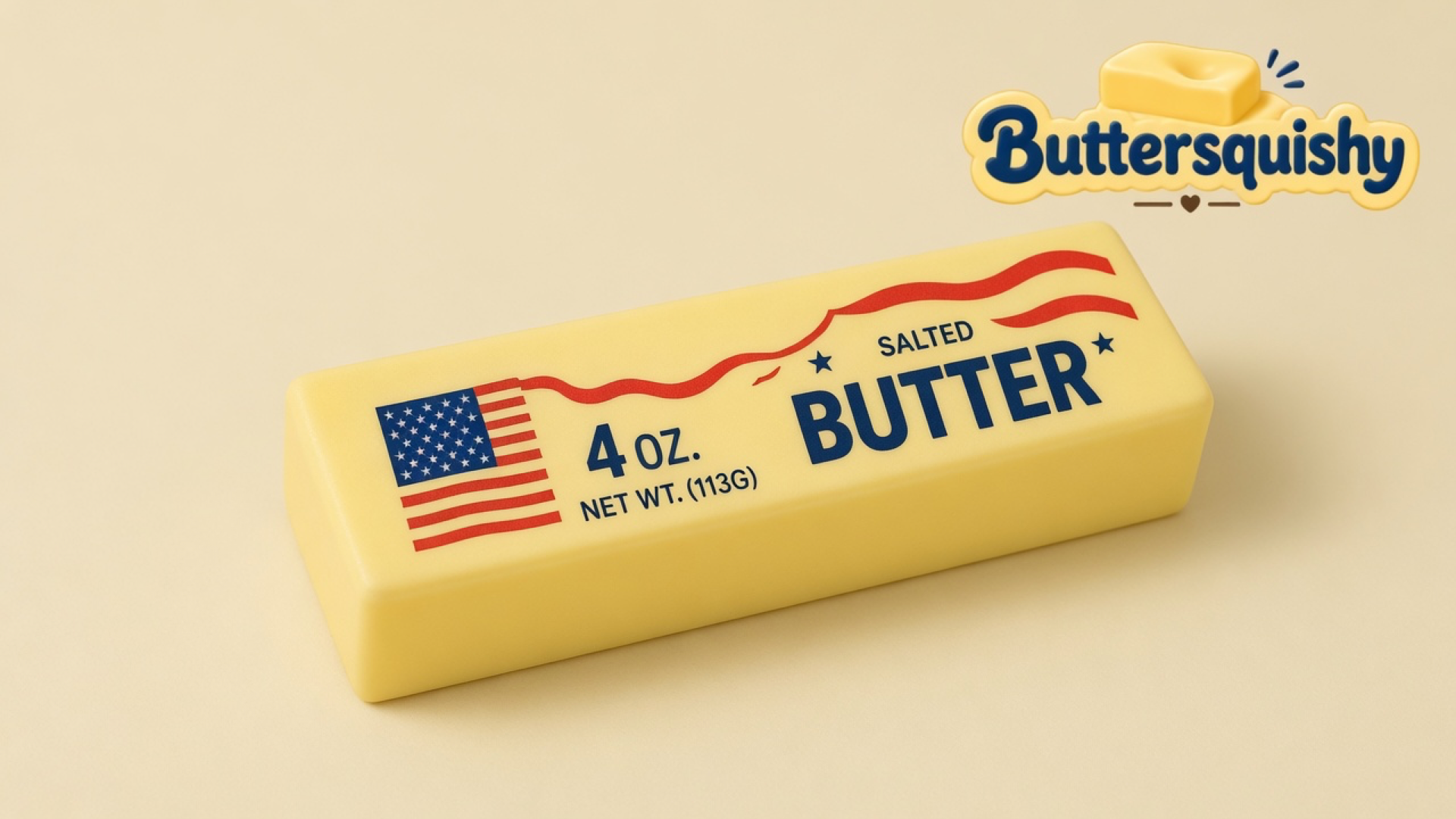 Pale yellow Stars and Stripes Butter loaf showing a flag canton, navy wrapper type, and red waves on a light cream studio set, Buttersquishy mark at the top right