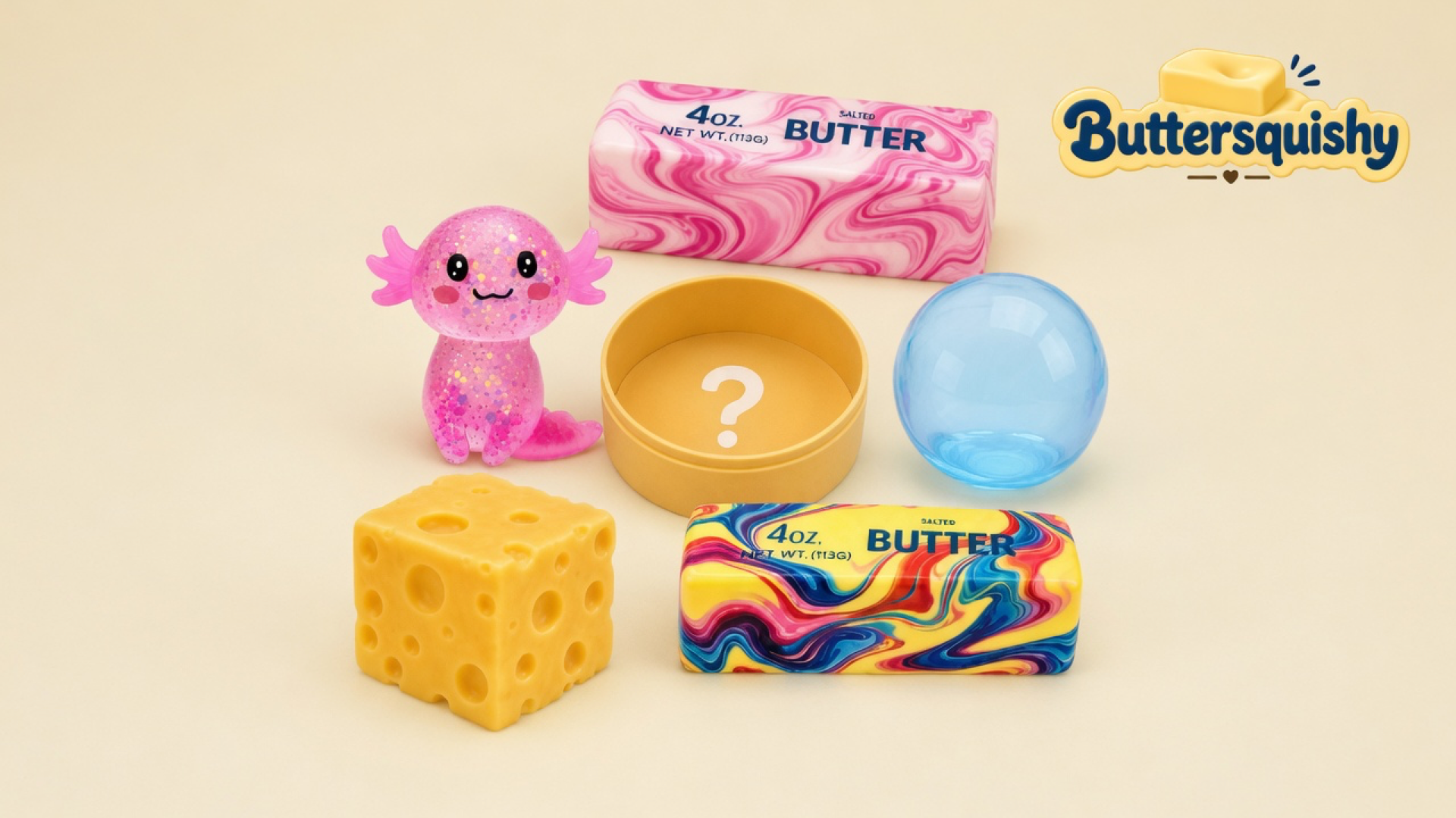Six mixed Cheese Cube Loaf 6-Pack toys — pink glitter axolotl, pink marble SALTED BUTTER loaf, mustard tin with a question mark, blue sphere, Swiss-hole cube, and rainbow marble SALTED BUTTER loaf — lined on a soft light-yellow cream studio surface, Buttersquishy logo in the upper right