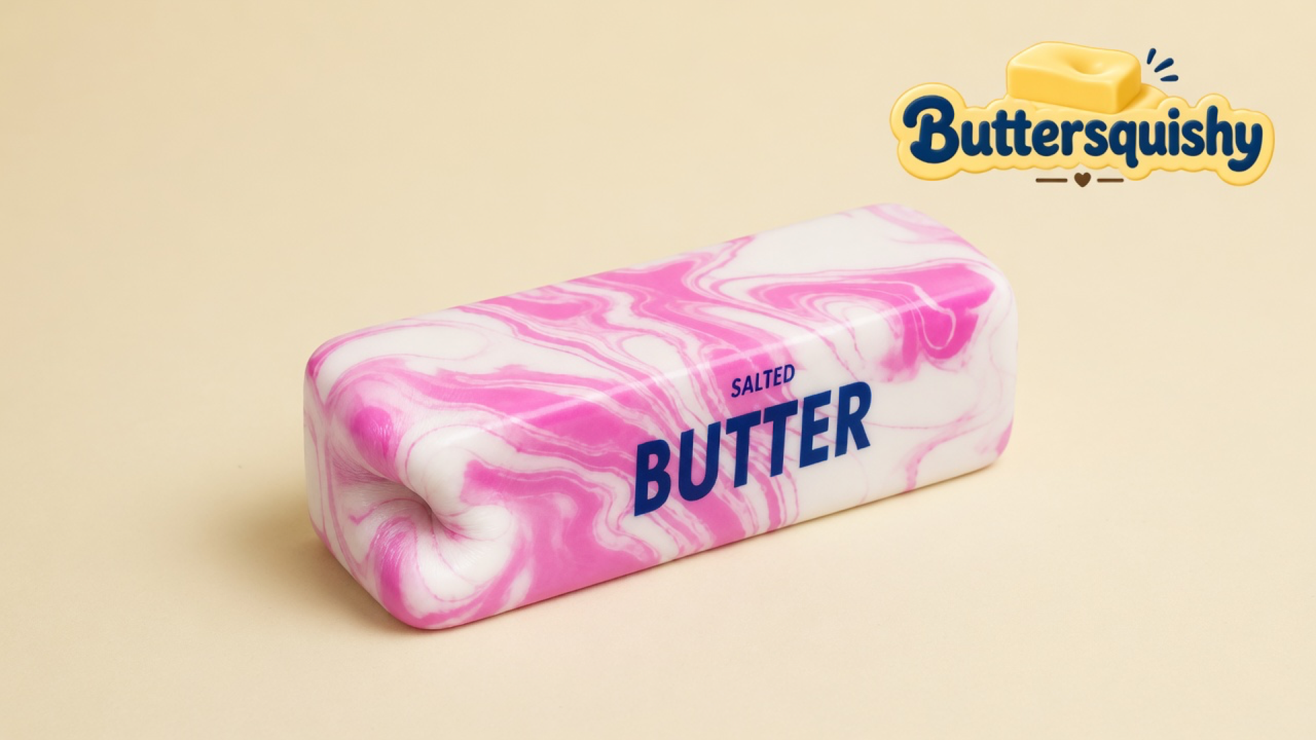 Pink-and-white marble butter loaf printed SALTED BUTTER on a light-yellow cream studio surface, Buttersquishy logo in the upper right