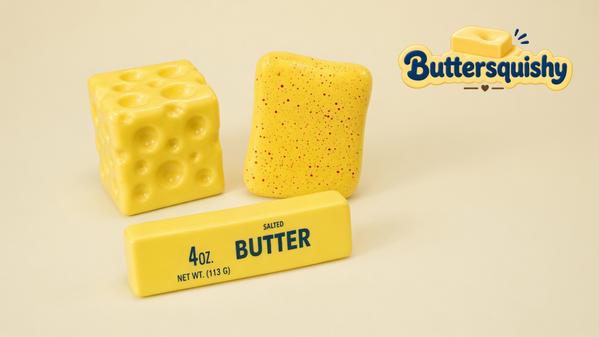 Yellow holey cheese cube, red-speckled yellow slab, and a navy 4OZ SALTED BUTTER stick on a light-yellow cream studio, Buttersquishy logo once at upper right
