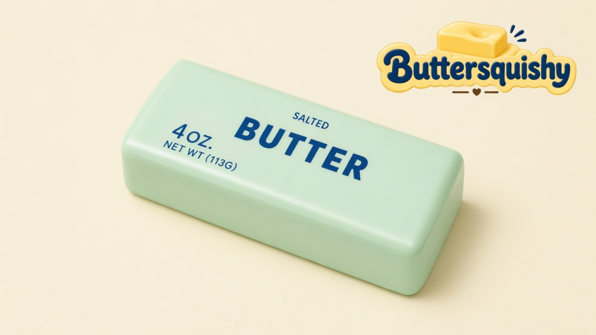 One pale mint-green salted-butter loaf with navy 4 OZ. and BUTTER type on a light-yellow cream studio surface, Buttersquishy logo in the upper right
