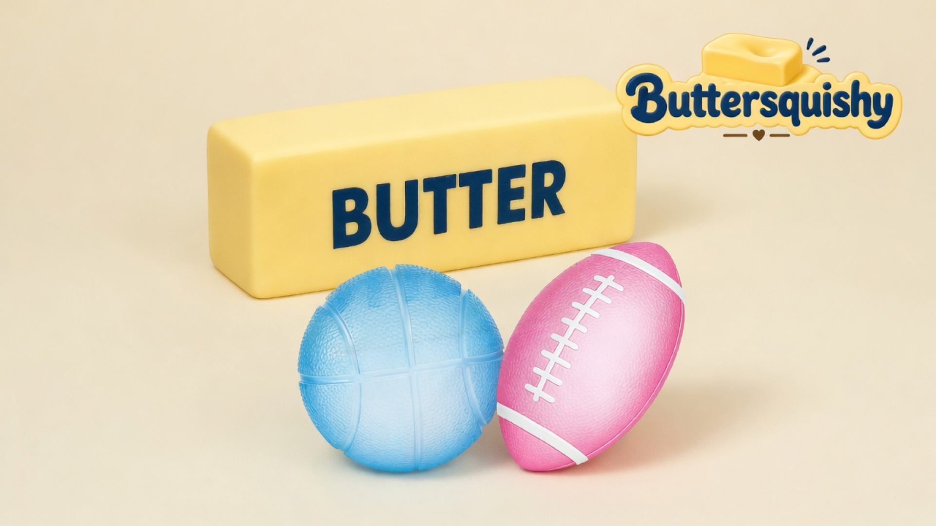 Yellow butter loaf with navy BUTTER type, a light-blue pebbled basketball, and a pink football with white laces on a cream studio surface, Buttersquishy logo in the upper right