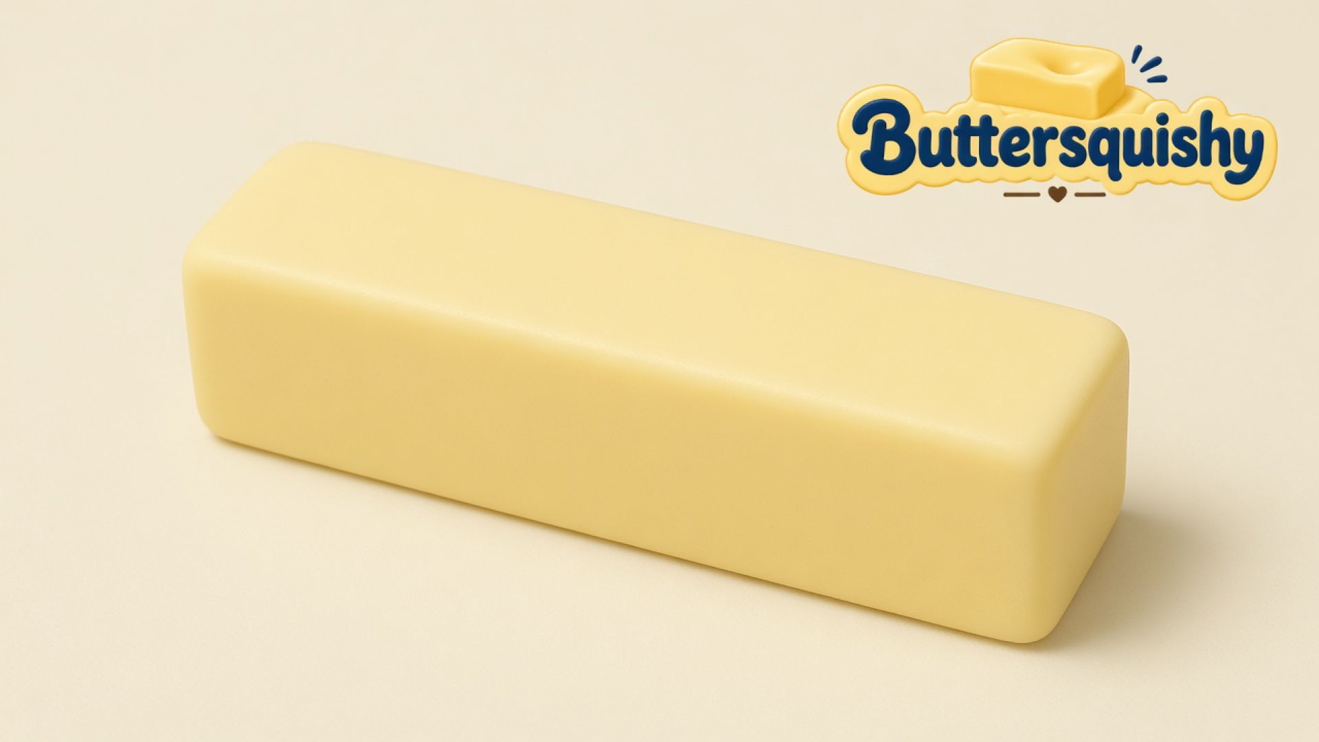 One pale yellow rectangular butter-stick squishy on a light-yellow cream studio surface, Buttersquishy logo in the upper right
