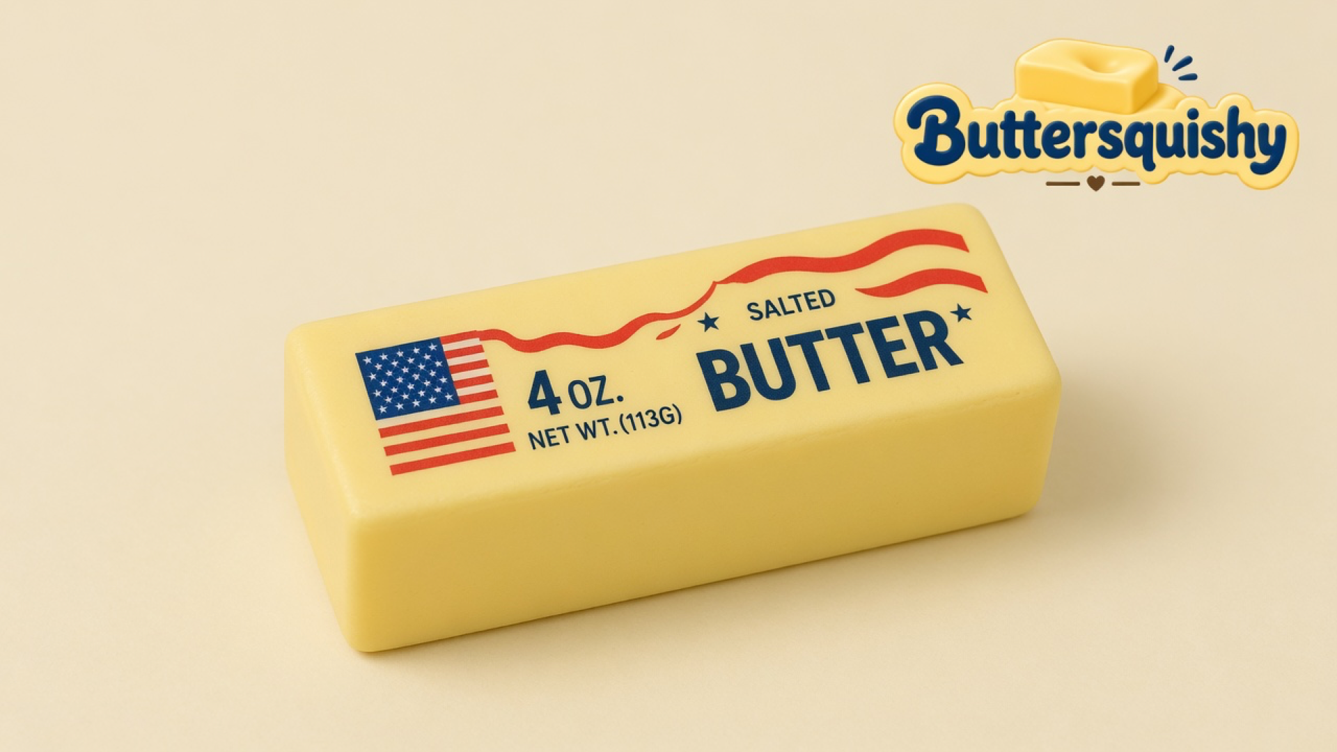 One pale yellow Stars and Stripes Butter stick with a US-flag print, navy SALTED BUTTER type, and red wave lines on a cream studio surface, Buttersquishy logo in the upper right