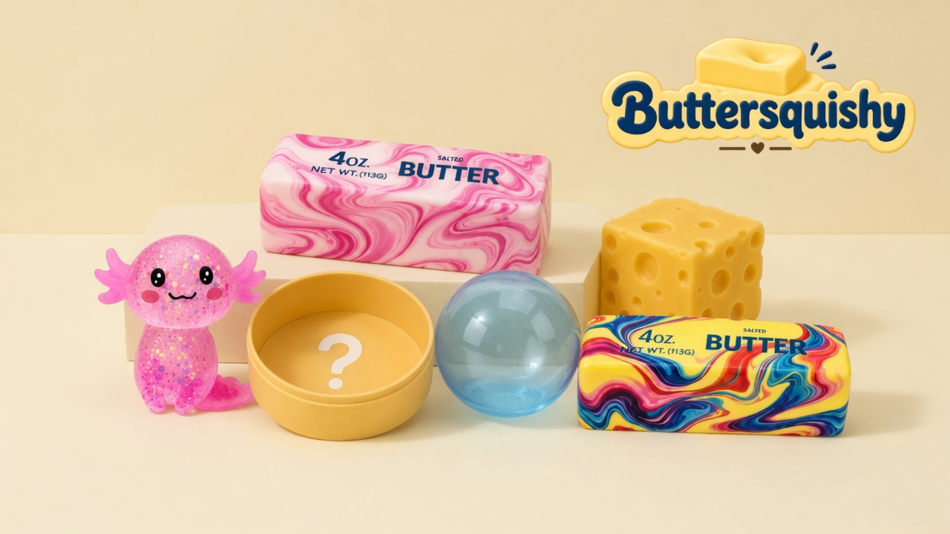 Six mixed Cheese Cube Loaf 6-Pack toys on a cream studio, Buttersquishy logo at upper right