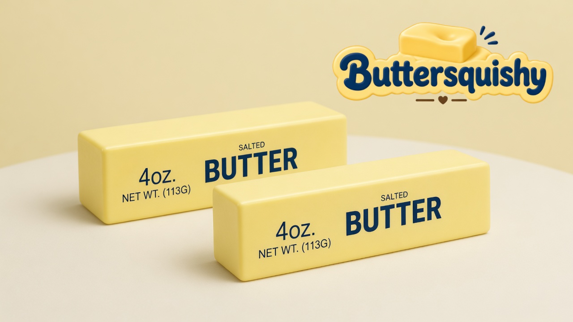 Two pale yellow Classic Butter Stick 4oz pieces printed 4OZ SALTED BUTTER on a light-yellow cream studio, Buttersquishy logo at upper right