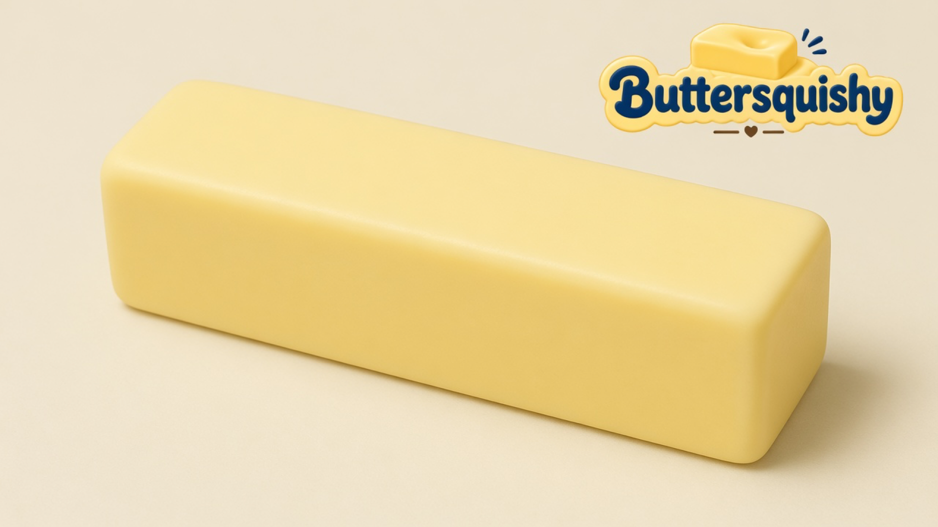 Pale yellow Classic Gift Butter stick with a blank face on a light-yellow cream studio surface, Buttersquishy logo in the upper right