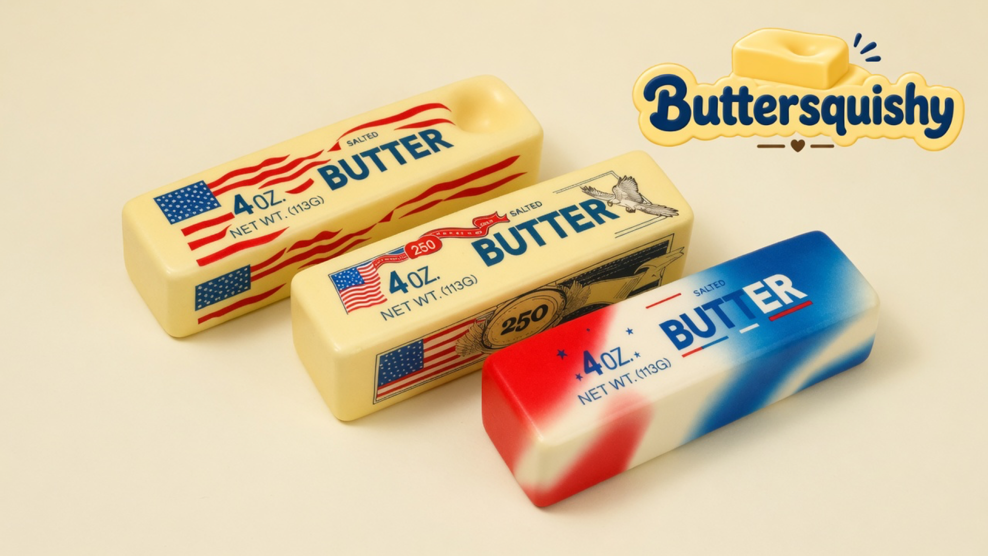 Three Stars and Stripes Butter sticks — two yellow flag wraps and one red-white-blue smear — on a light-yellow cream studio, Buttersquishy logo at upper right