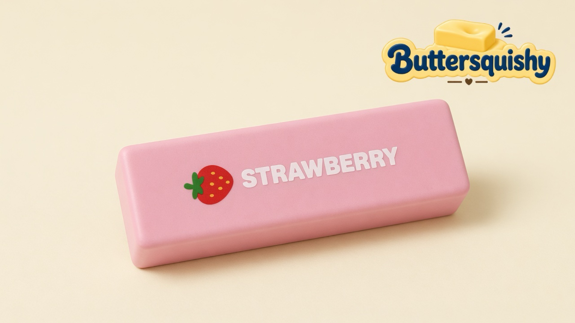 One candy-pink Strawberry Butter Stick with a red berry icon and white STRAWBERRY type on a soft light-yellow cream studio, Buttersquishy logo in the upper right