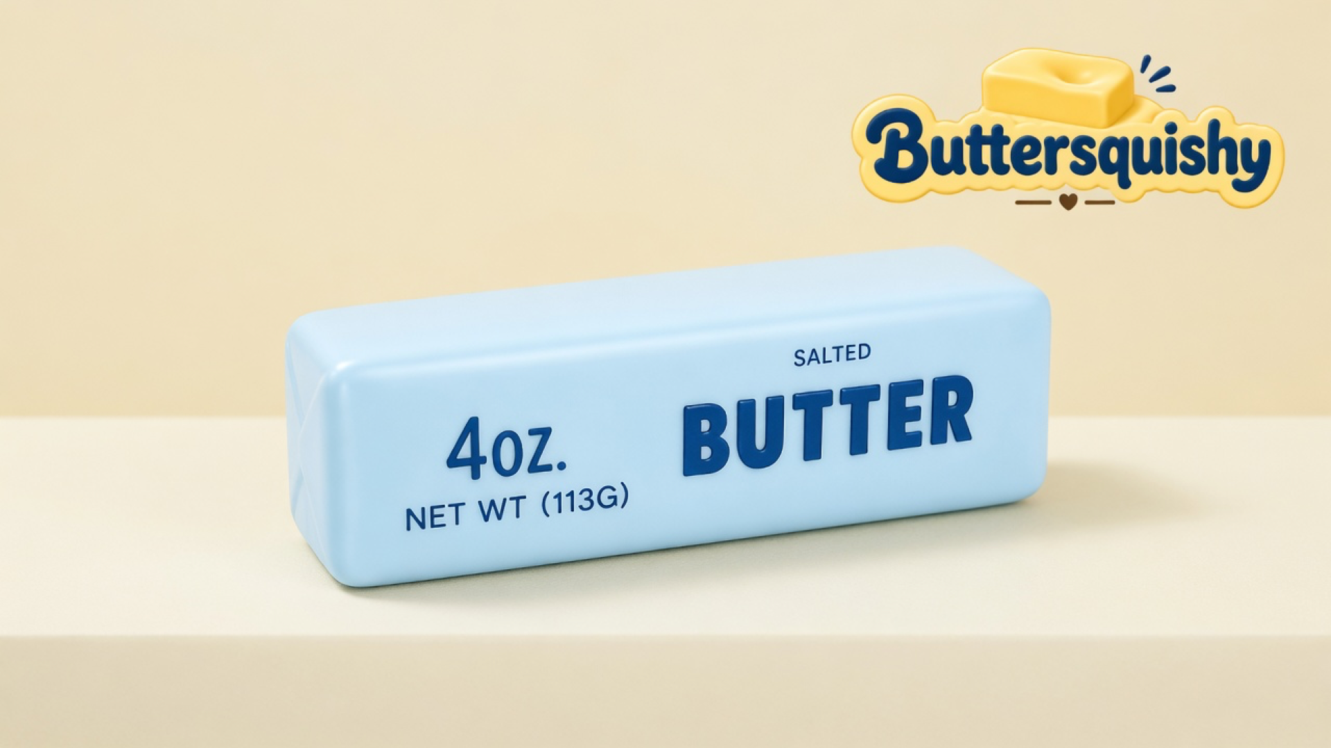 Ice-blue Blue Butter Stick loaf printed 4OZ and SALTED BUTTER on a light-yellow cream studio surface, Buttersquishy logo in the upper right