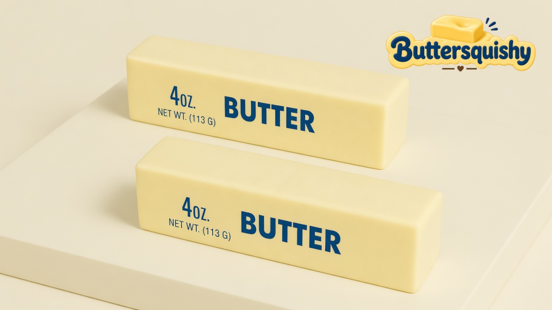 Two pale yellow rectangular butter sticks printed 4OZ and BUTTER on a light-yellow cream studio platform, Buttersquishy logo in the upper right