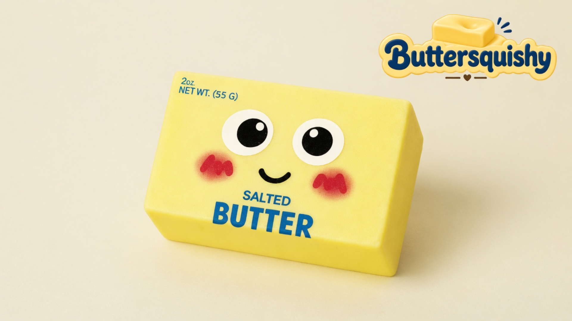 Pale yellow Face Cube Butter loaf with cartoon eyes, blush, and SALTED BUTTER print on a light-yellow cream studio surface, Buttersquishy logo in the upper right