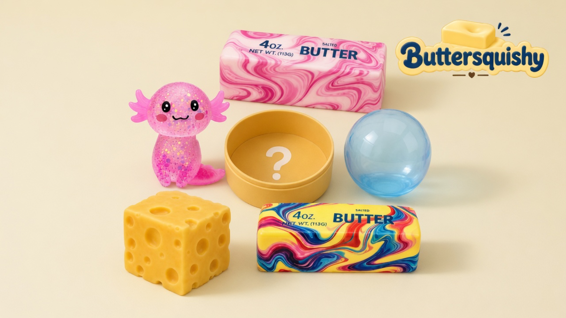 Six-piece Cheese Cube Loaf mix — pink glitter axolotl, pink marble butter loaf, yellow tin with a question mark, blue sphere, Swiss-hole cube, and rainbow marble butter loaf — on a light-yellow cream studio surface, Buttersquishy logo in the upper right