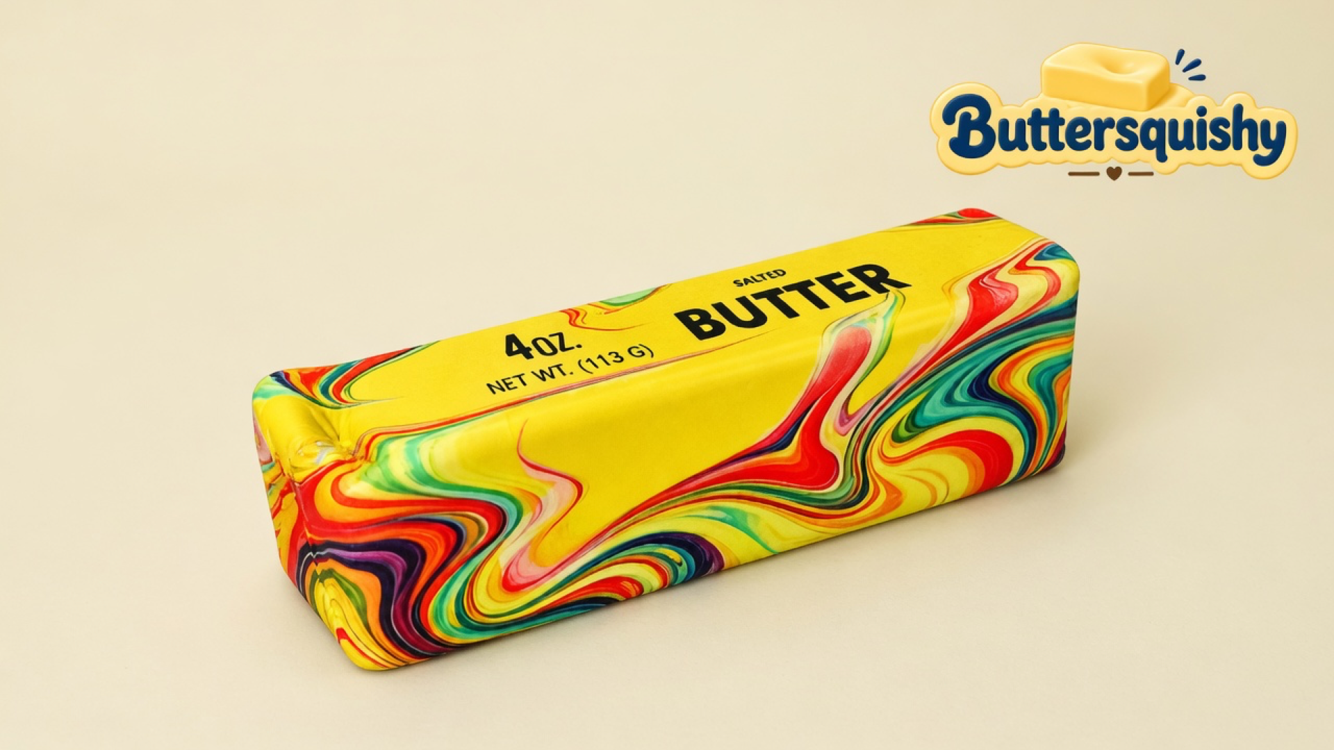 Yellow SALTED BUTTER loaf with red-blue-green oil-paint marble sides on a light-yellow cream studio table, Buttersquishy logo in the upper right