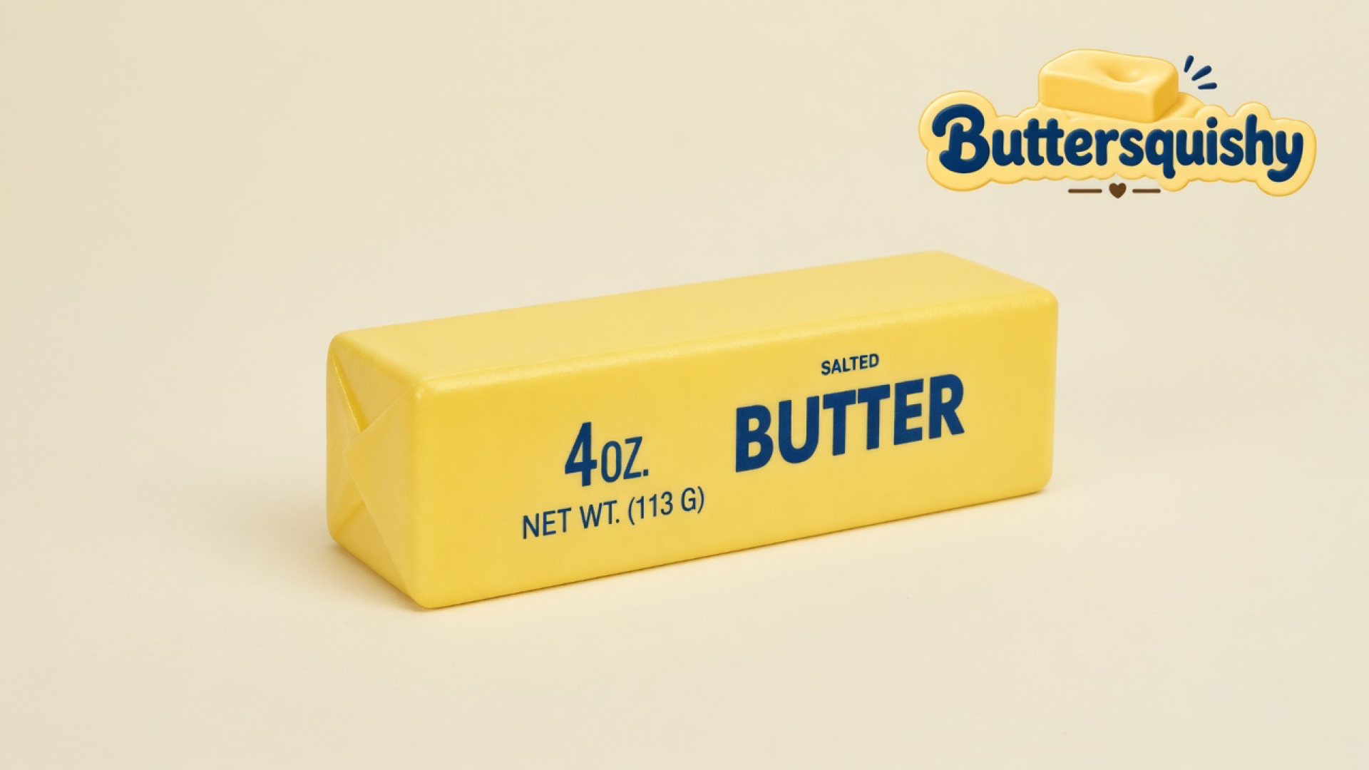 One pale-yellow Classic Butter Stick 4oz with navy SALTED BUTTER type on a light-yellow cream studio surface, Buttersquishy logo in the upper right
