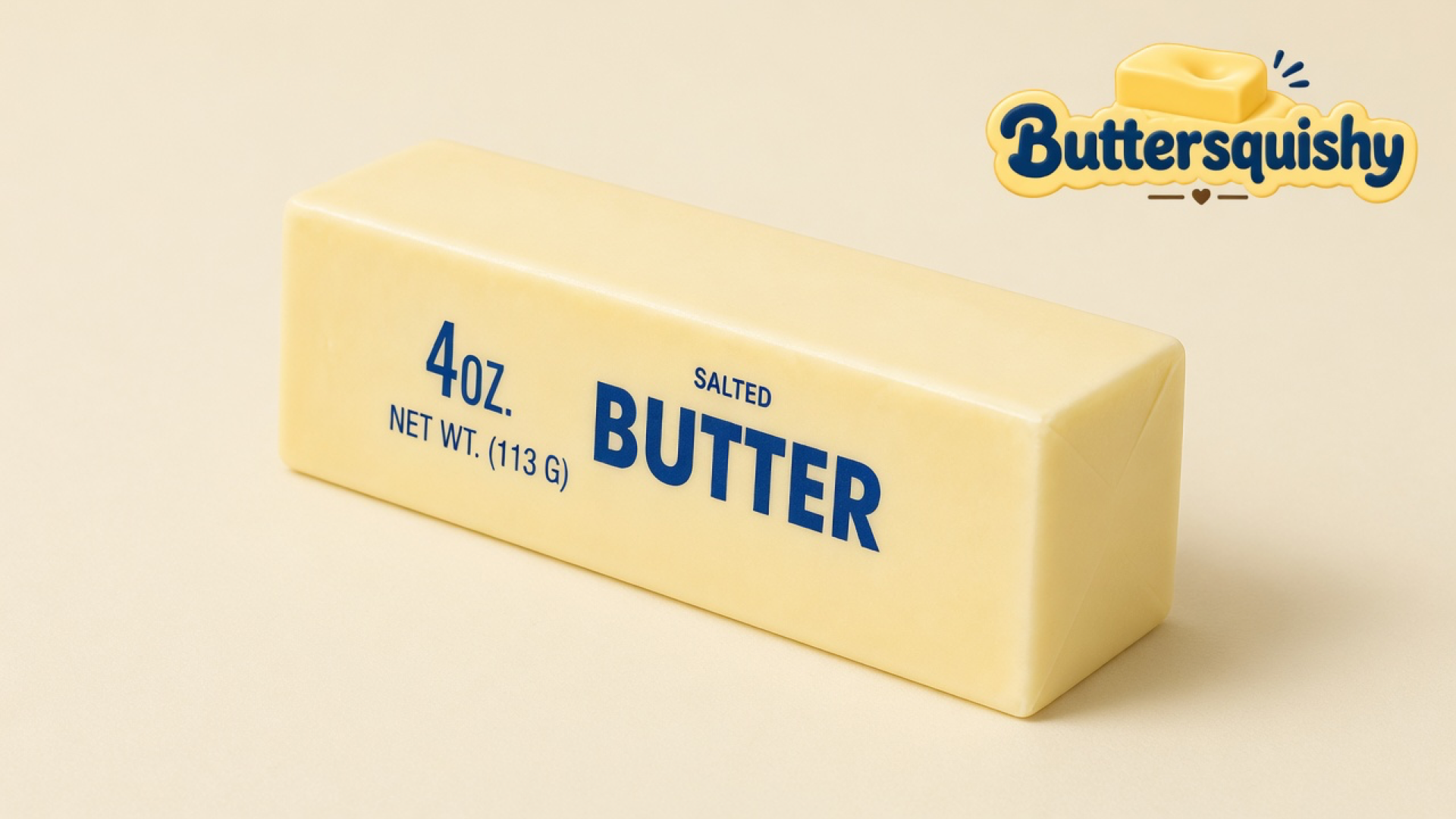 One pale-yellow Classic Gift Butter stick with navy 4OZ SALTED BUTTER type on a light-yellow cream studio surface, Buttersquishy logo in the upper right