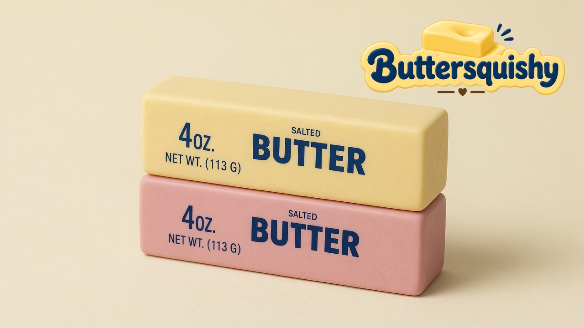 Pale yellow and dusty-pink rectangular Bread Toast Loaf 2-Pack sticks with navy SALTED BUTTER type on a light-yellow cream studio, Buttersquishy logo at upper right