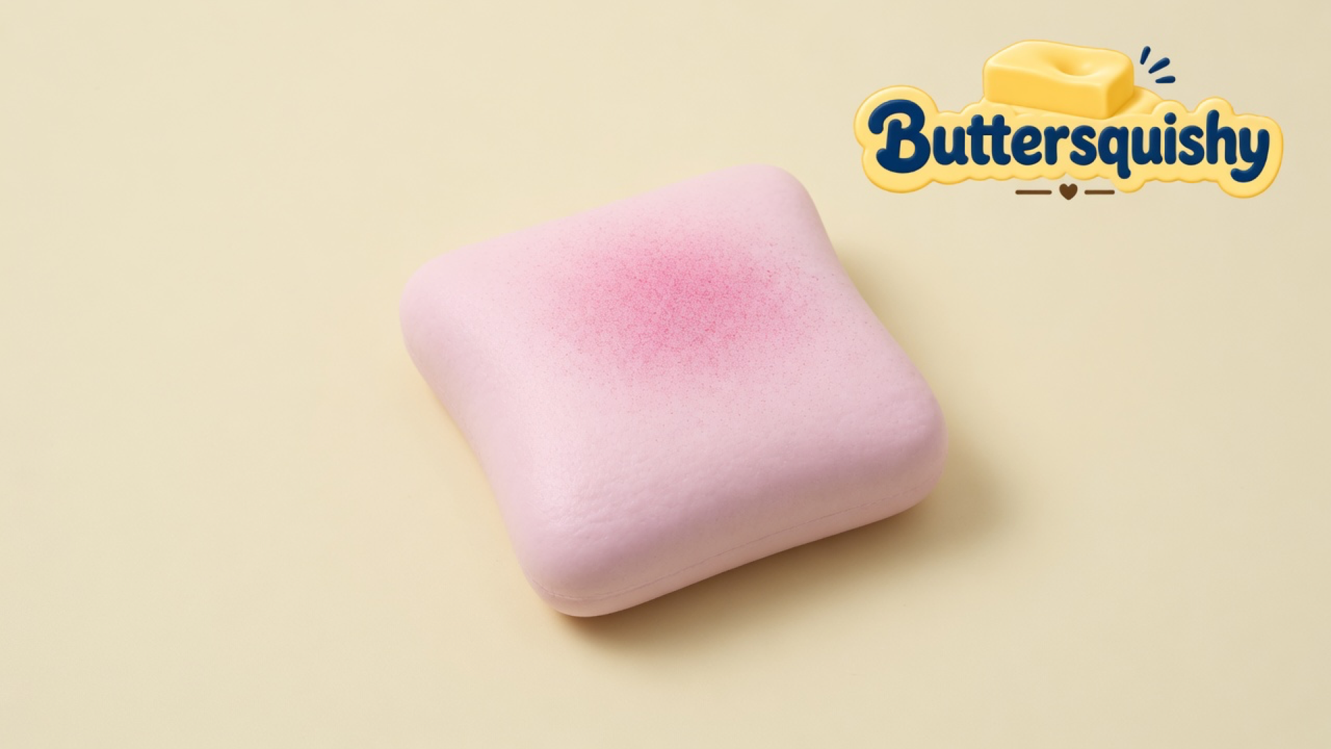 Pale pink Bread Toast Loaf with a rose-pink toasted center on a light-yellow cream studio, Buttersquishy logo at upper right
