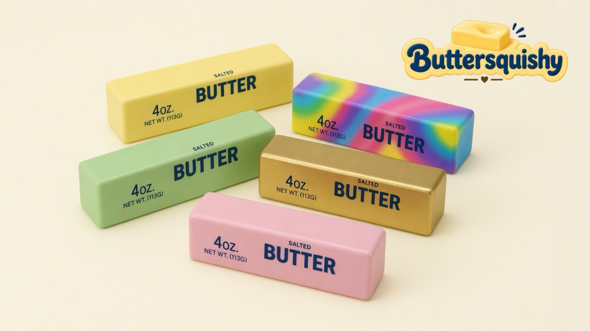 Five Mixed Butter Pack sticks — pale yellow, mint, gold, pink, and a rainbow swirl — each printed SALTED BUTTER, on a light-yellow cream studio with the Buttersquishy logo at upper right