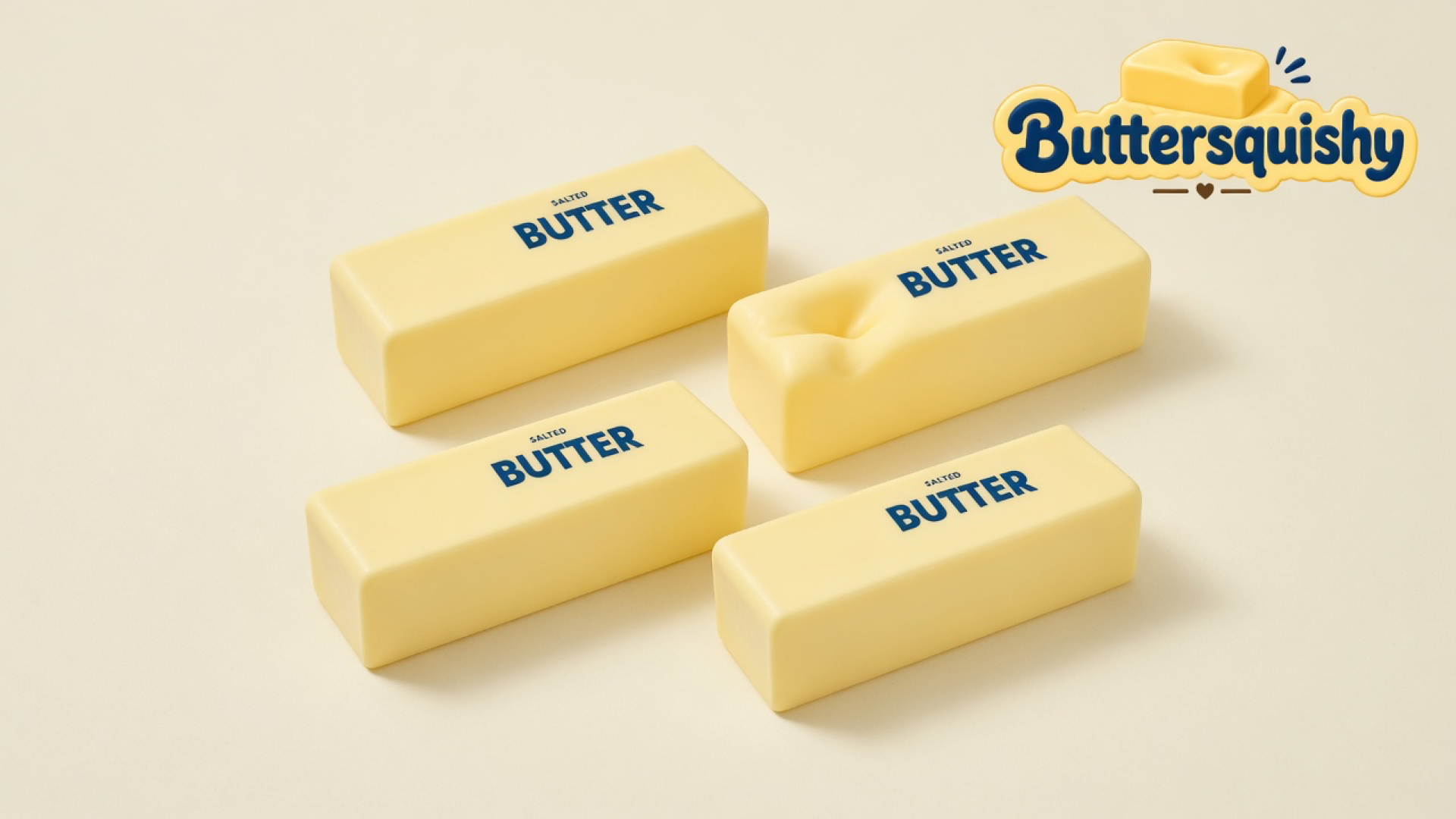 Four pale yellow Classic Butter Stick loaves printed SALTED BUTTER, one with a thumb dent, on a light-yellow cream studio sweep, Buttersquishy logo in the upper right