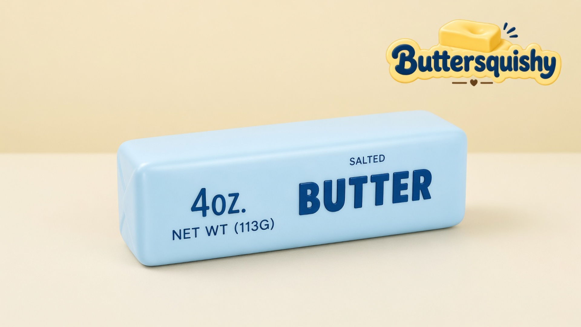 Pale-blue butter-stick loaf printed with navy 4OZ and SALTED BUTTER on a soft light-yellow cream studio table, Buttersquishy logo in the upper right