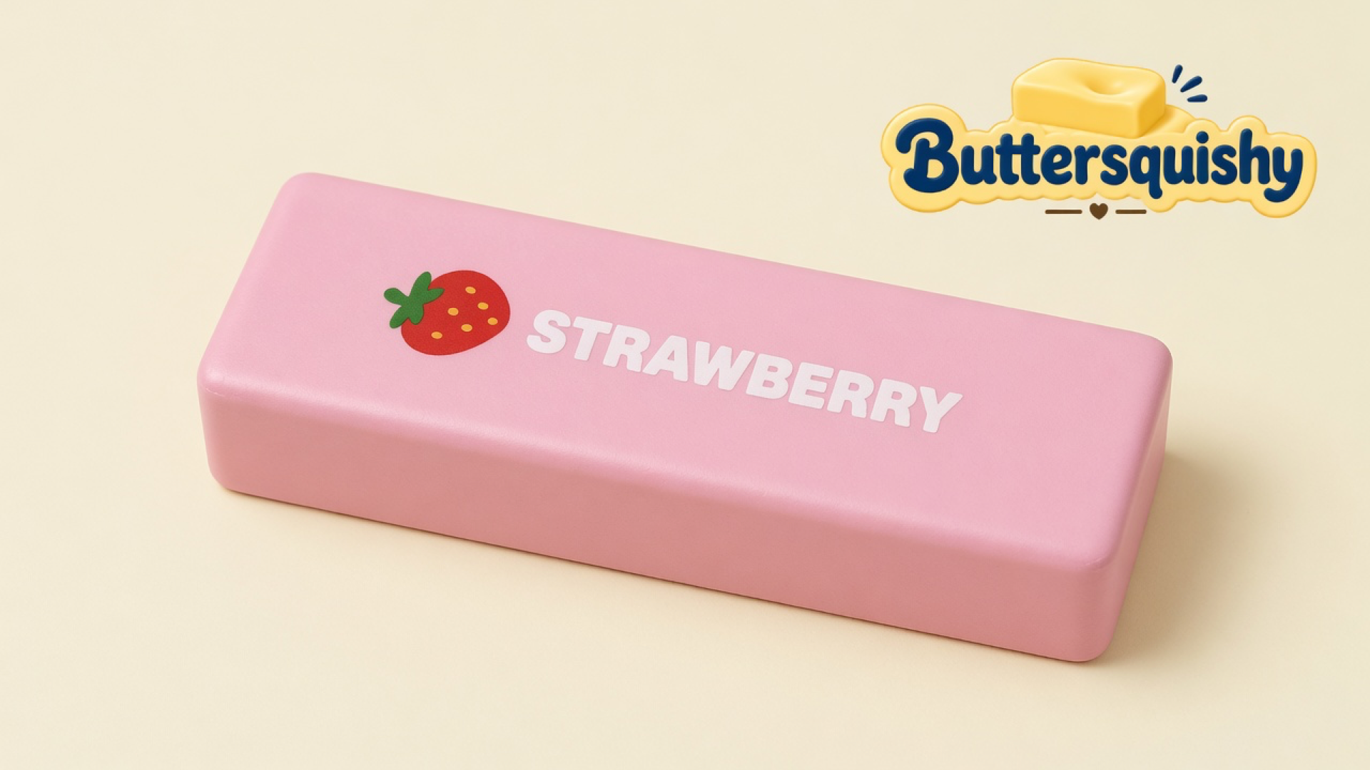 One candy-pink Strawberry Butter Stick with a red berry mark and white STRAWBERRY type on a soft light-yellow cream studio, Buttersquishy logo once at the upper right