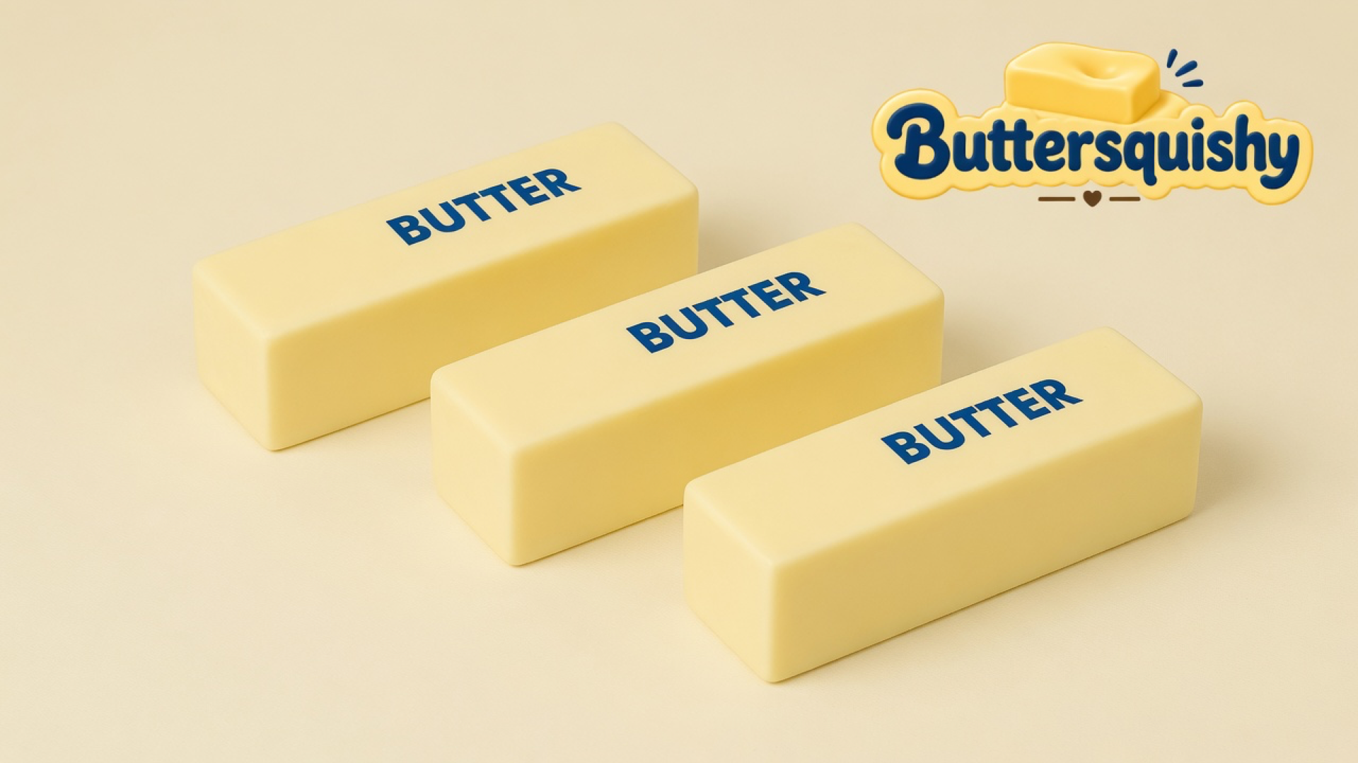 Three pale-yellow Classic Butter Stick 4oz bars printed BUTTER on a light-yellow cream studio surface, Buttersquishy logo in the upper right