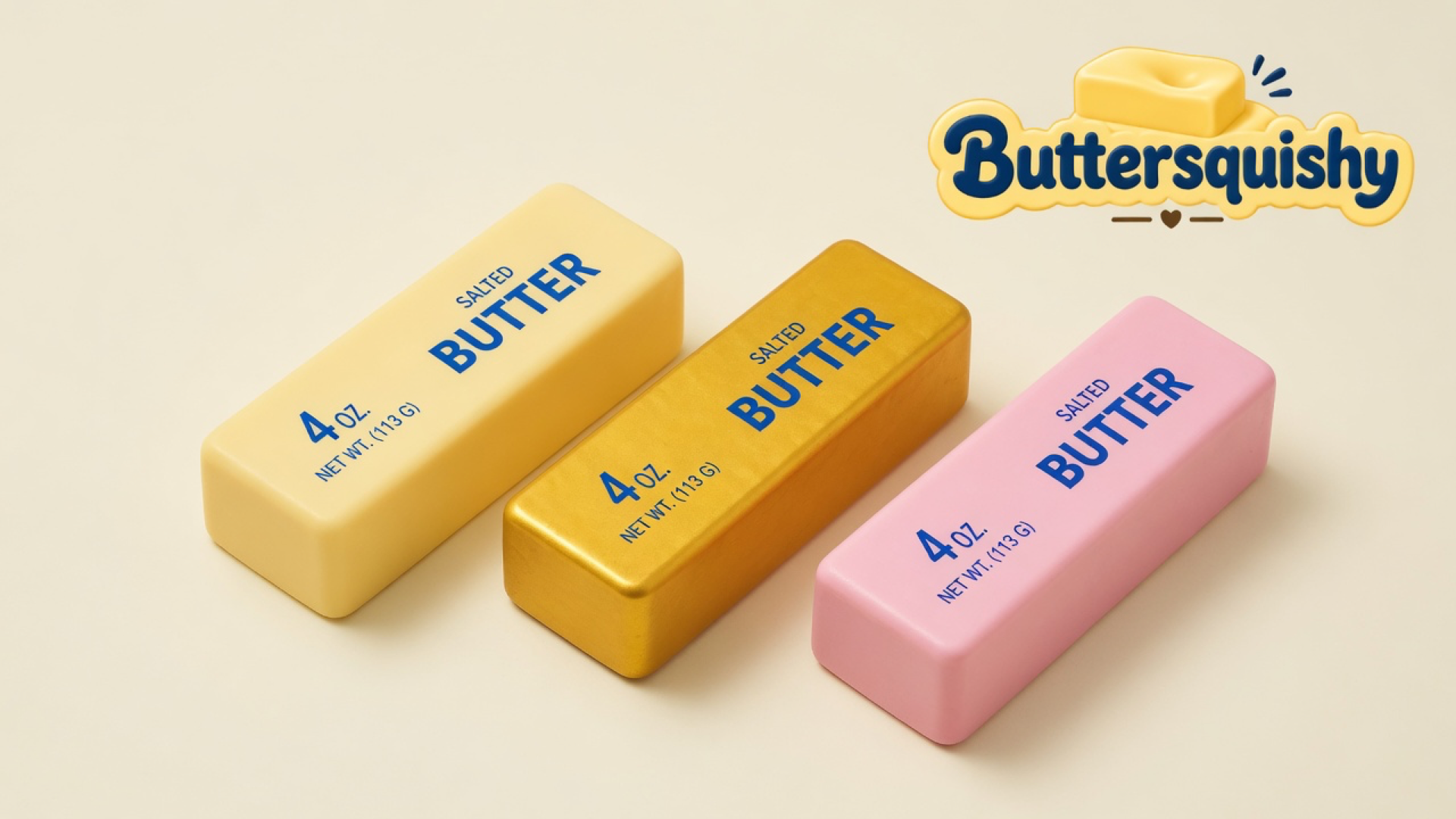 Three cream, gold, and pink Sunset Trio Butter sticks with navy SALTED BUTTER print on a light-yellow cream studio surface, Buttersquishy logo in the upper right