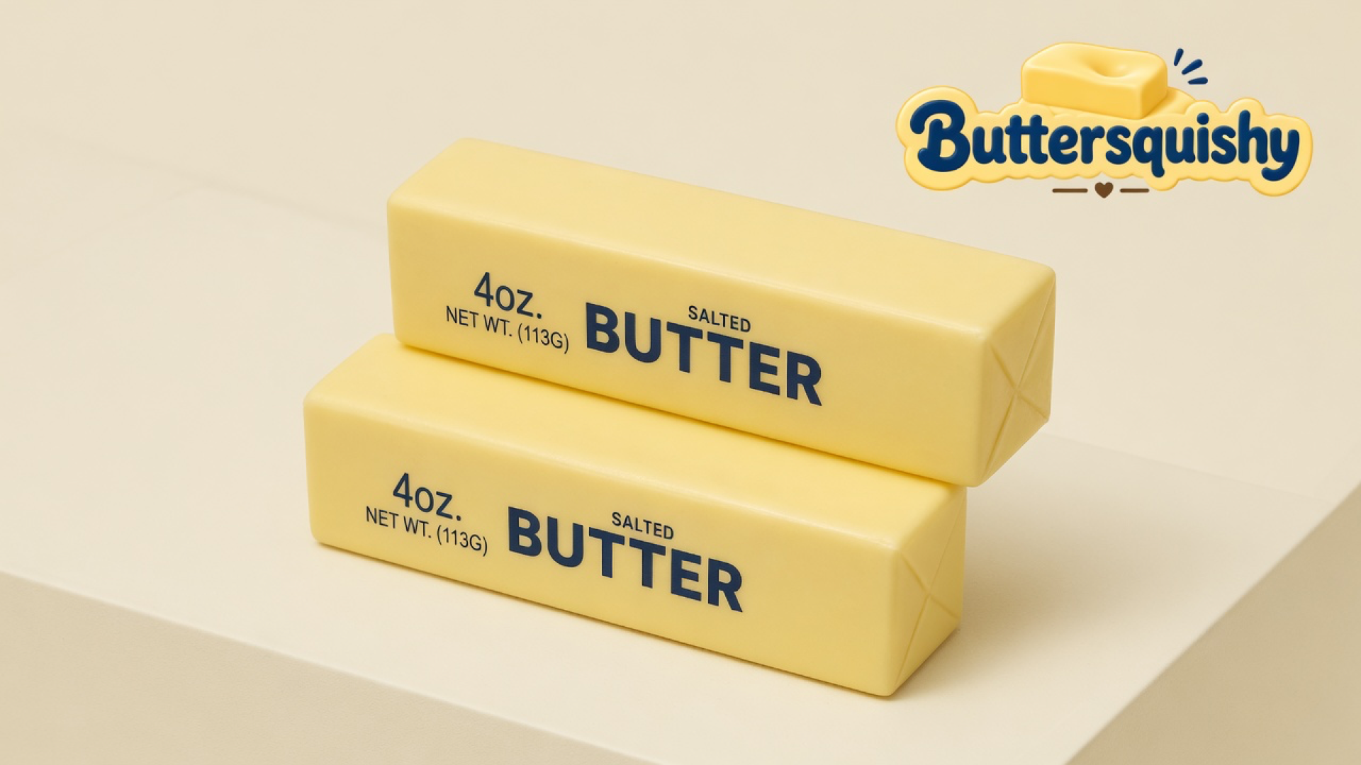 Two pale yellow SALTED BUTTER stick squishies stacked on a light-yellow cream studio, Buttersquishy logo in the upper right