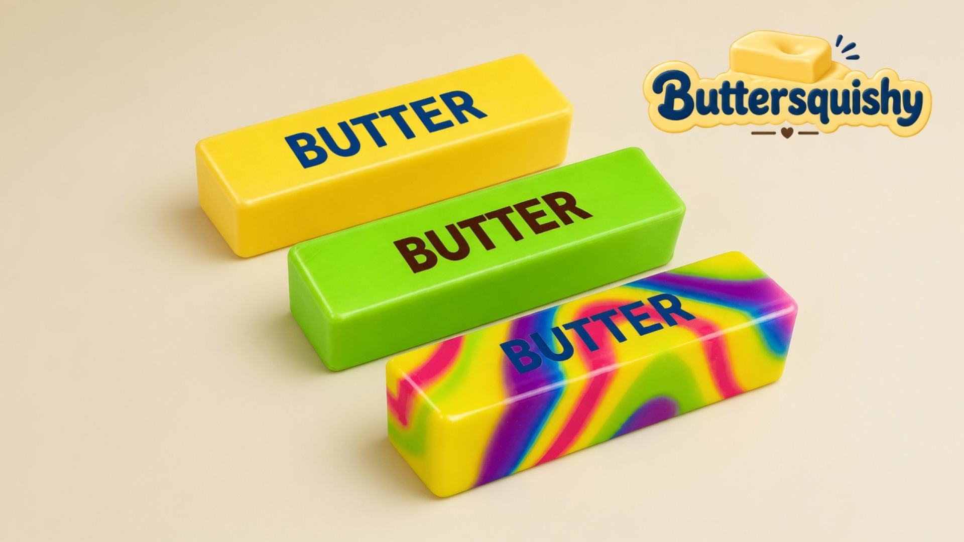 Three Swirl Mix butter sticks — solid yellow, lime green, and rainbow swirl — each printed BUTTER on a light-yellow cream studio surface, Buttersquishy logo in the upper right
