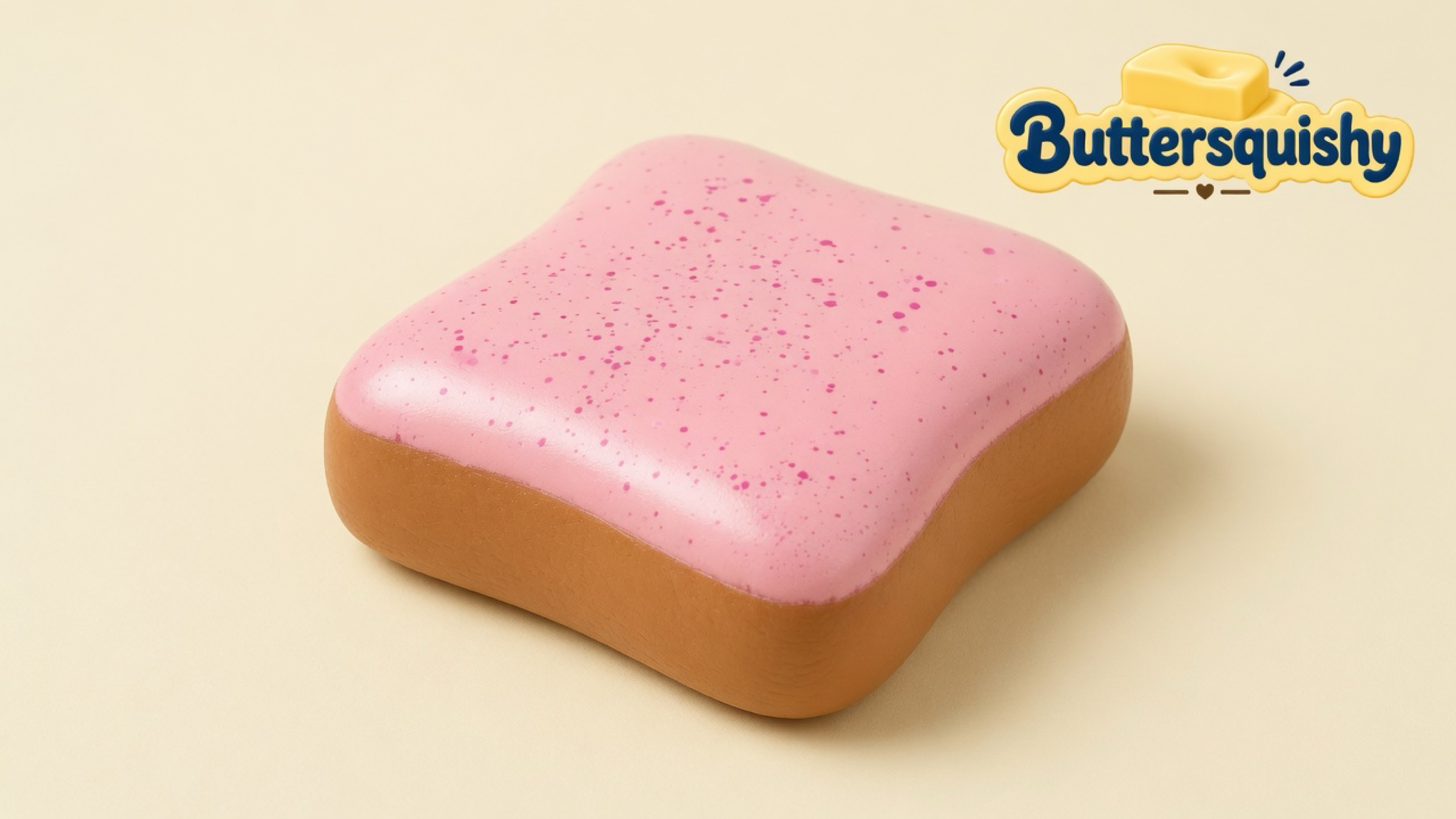 One rounded square Bread Toast Loaf with a pink speckled frosting face and golden-brown crust walls on a light-yellow cream studio, Buttersquishy logo at upper right