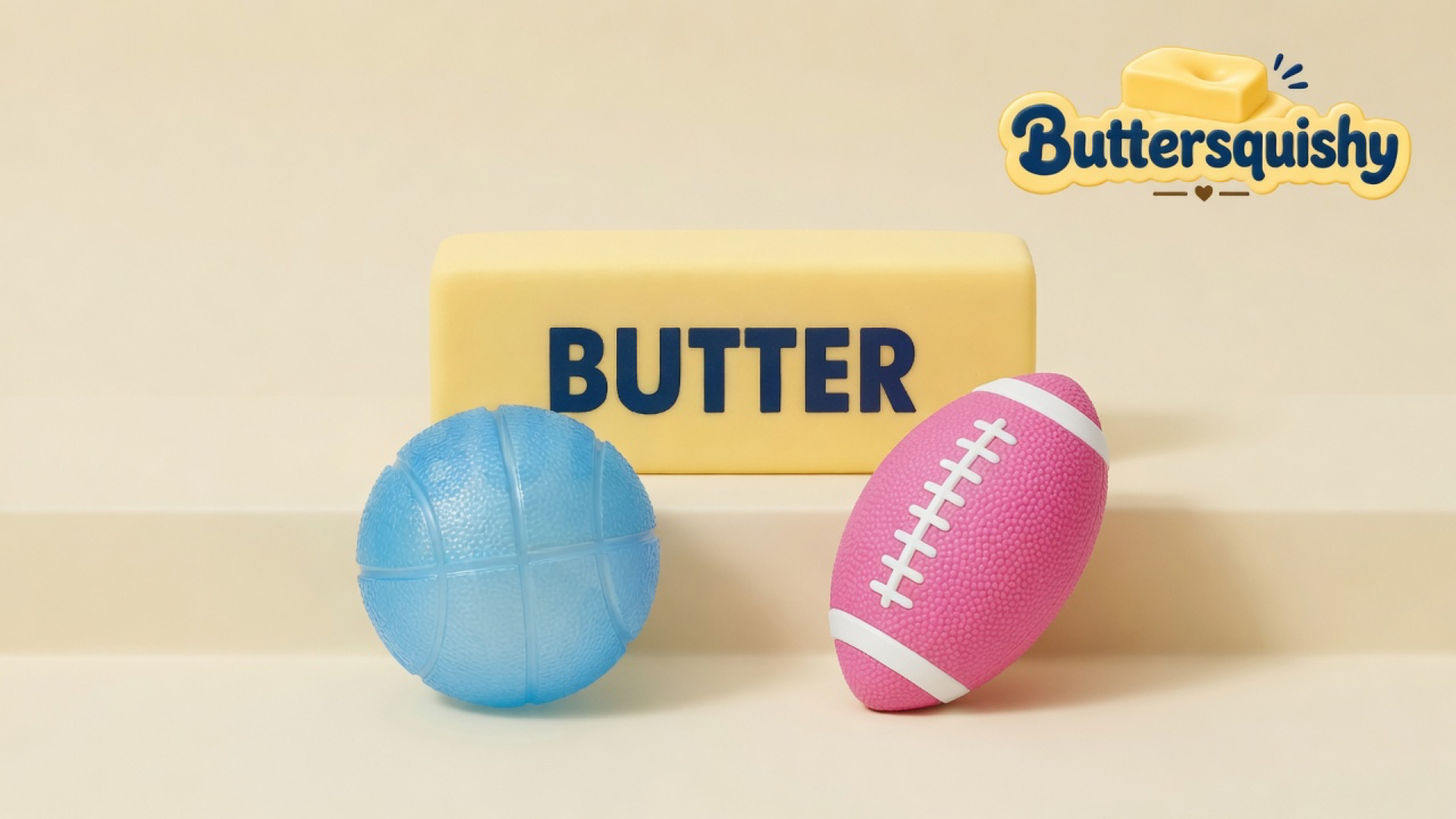 A yellow loaf printed BUTTER, a light-blue basketball, and a pink football with white laces on a light-yellow cream studio, Buttersquishy logo in the upper right