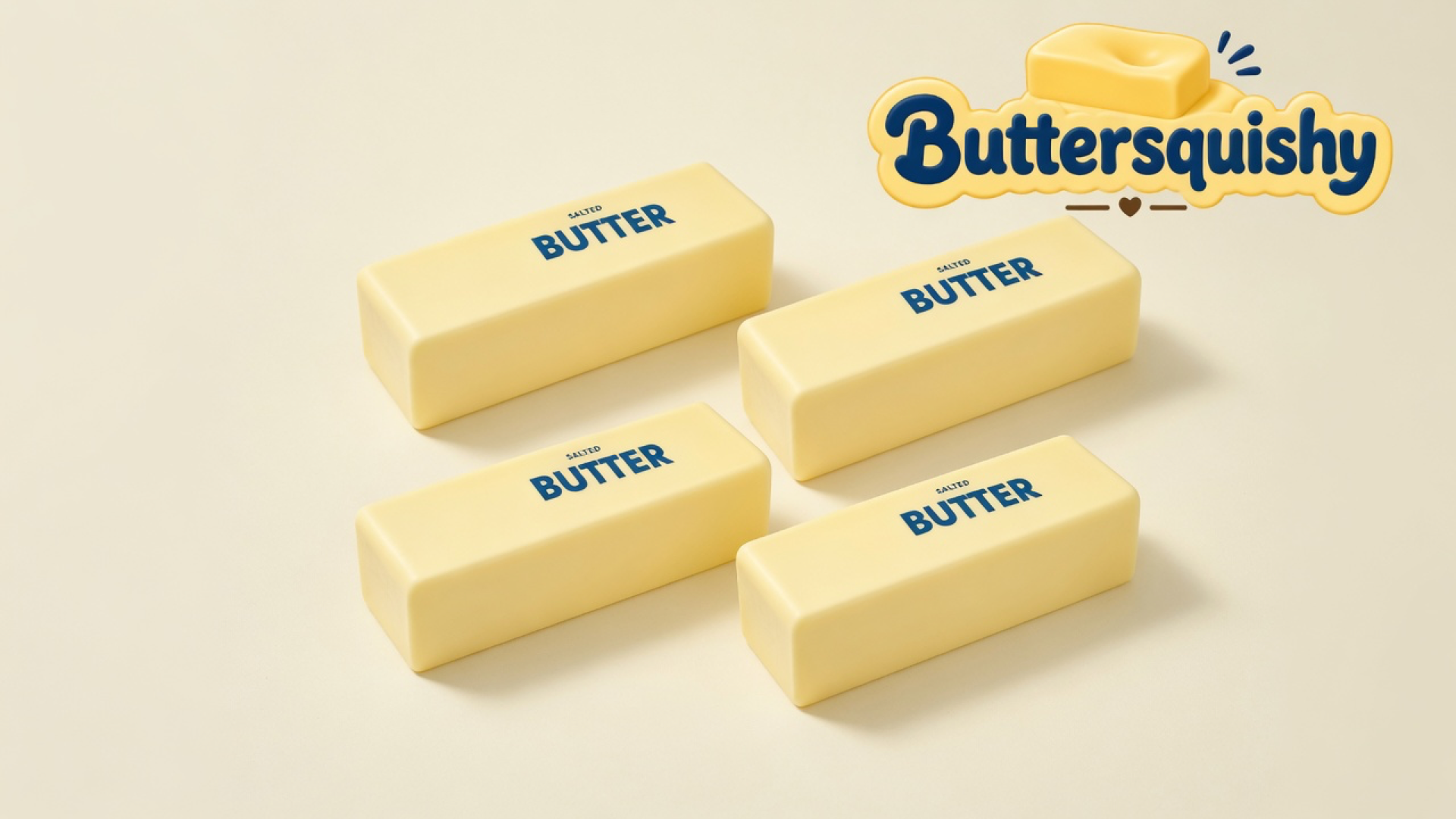 Four matching pale-yellow rectangular butter sticks with navy SALTED BUTTER type on a cream studio sweep, Buttersquishy wordmark once at the upper right
