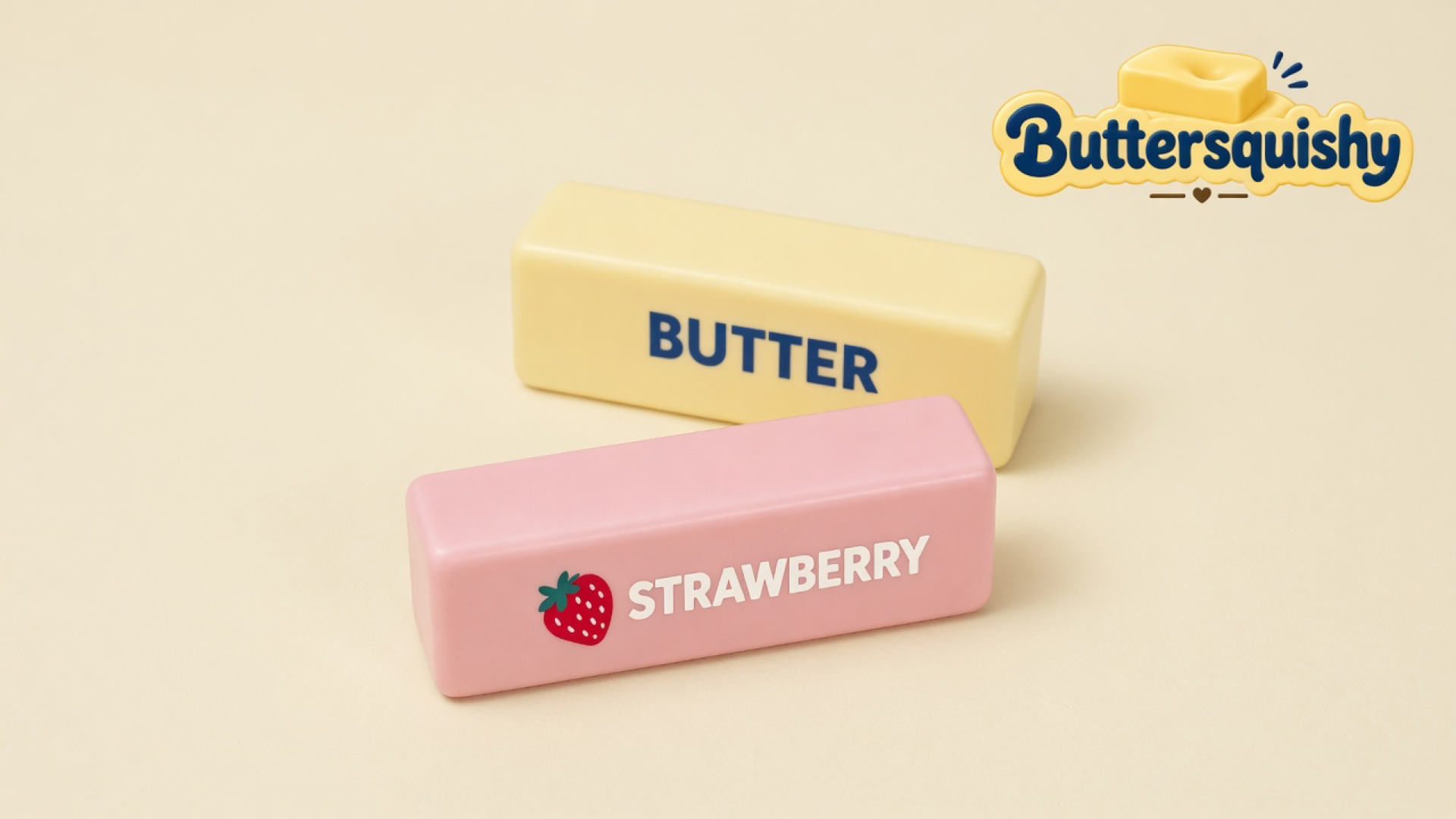 Pale yellow BUTTER loaf and pink STRAWBERRY loaf on a light-yellow cream studio, Buttersquishy logo in the upper right