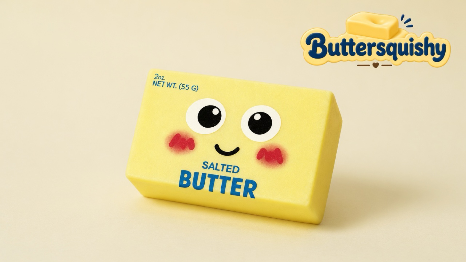 Pale yellow Face Cube Butter loaf with cartoon eyes and SALTED BUTTER print on a light-yellow cream studio surface, Buttersquishy logo in the upper right