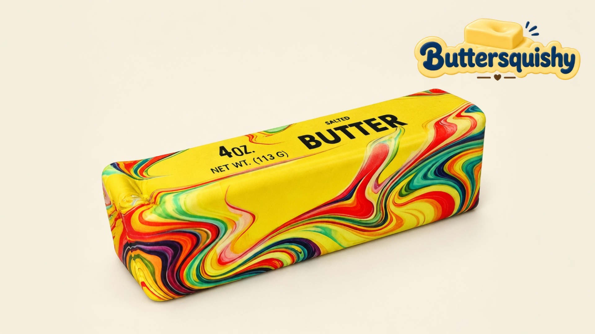 One Oil-Paint Swirl Butter stick with a yellow SALTED BUTTER face and rainbow marble sides on a light-yellow cream studio surface, Buttersquishy logo in the upper right
