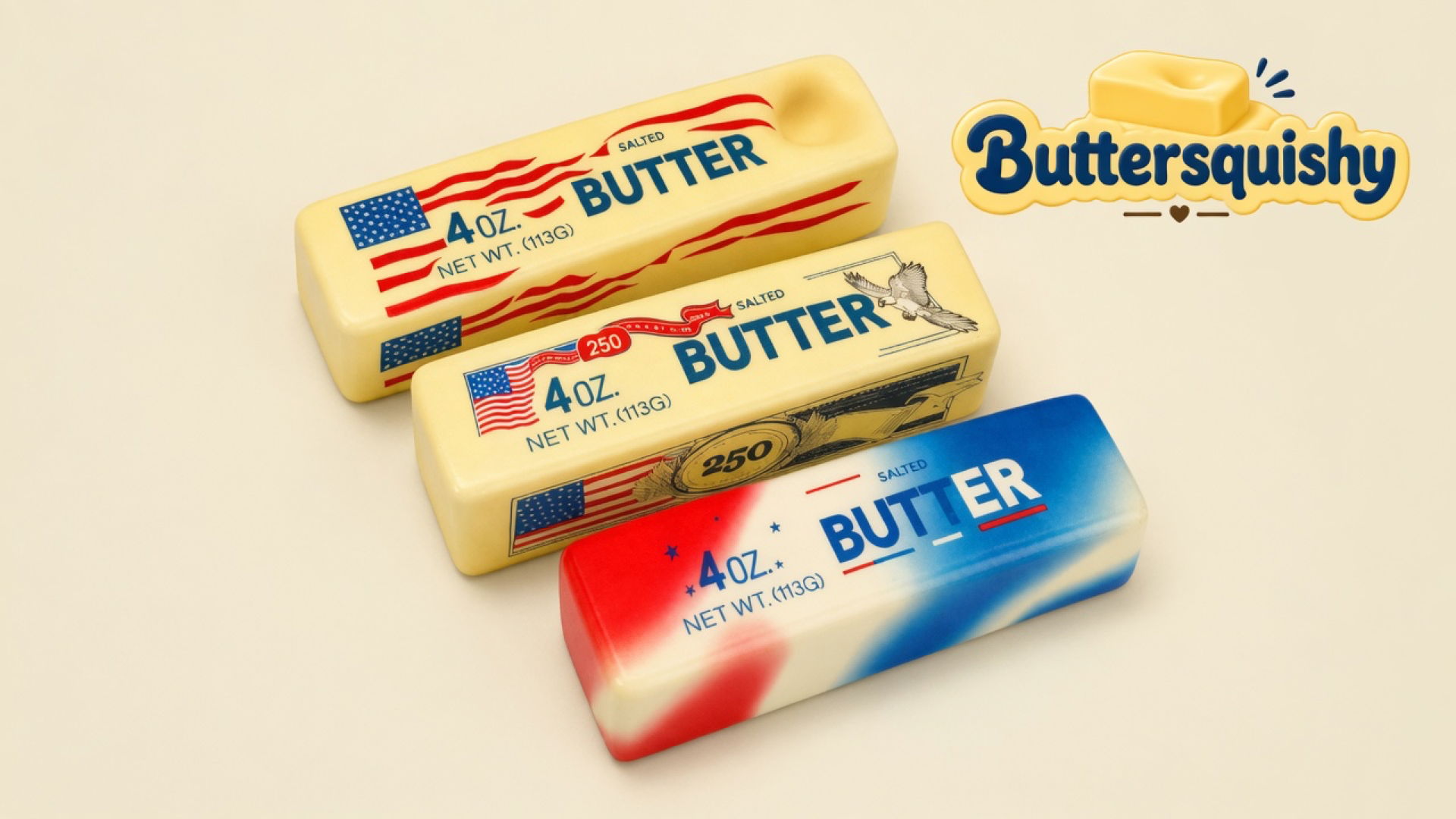 Three Stars and Stripes Butter sticks — a wave-flag loaf, an eagle-250 loaf, and a red-white-blue swirl loaf — on a light-yellow cream studio surface, Buttersquishy logo in the upper right